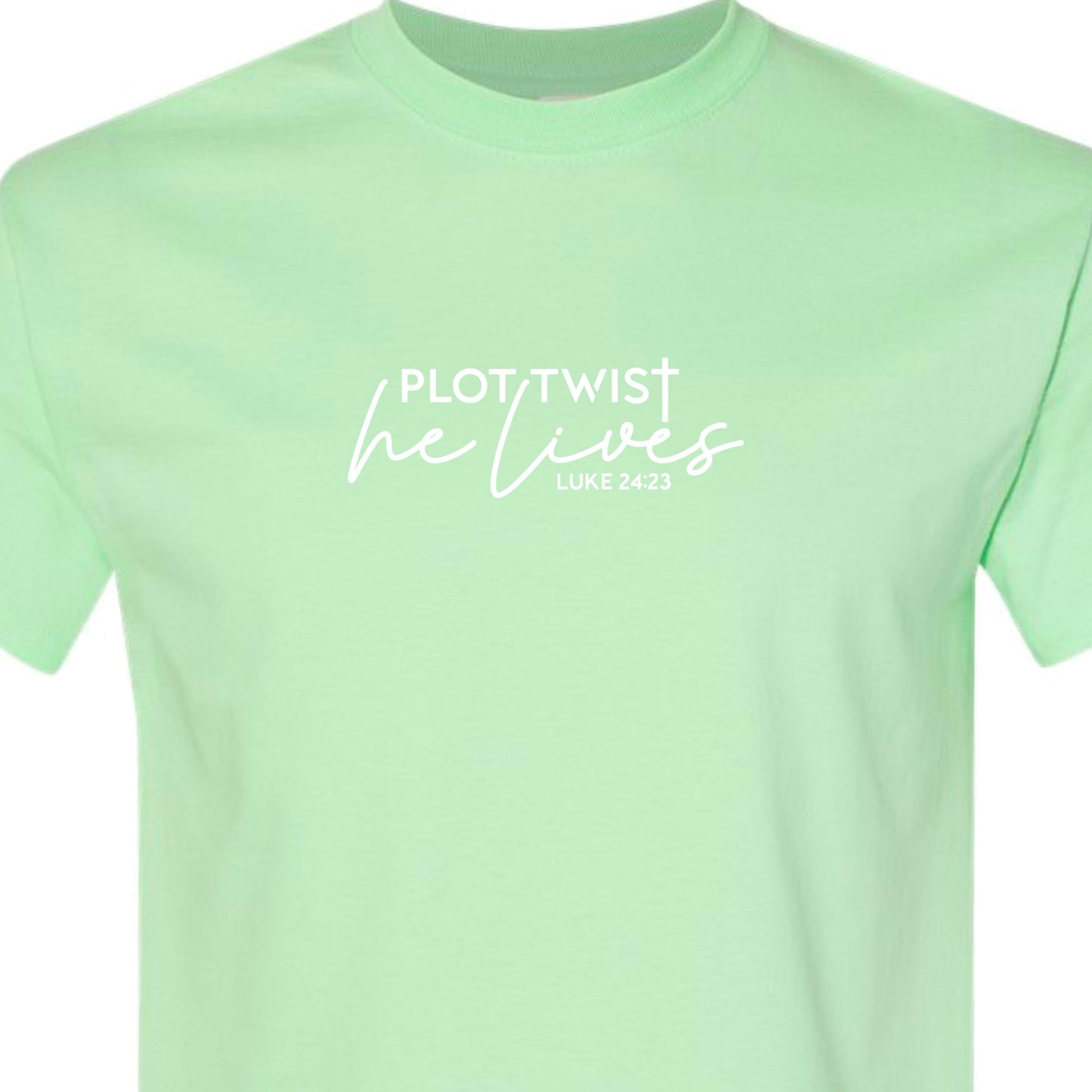 Mint adult tshirt that reads, in white lettering: Plot Twist, He Lives - Luke 24:23