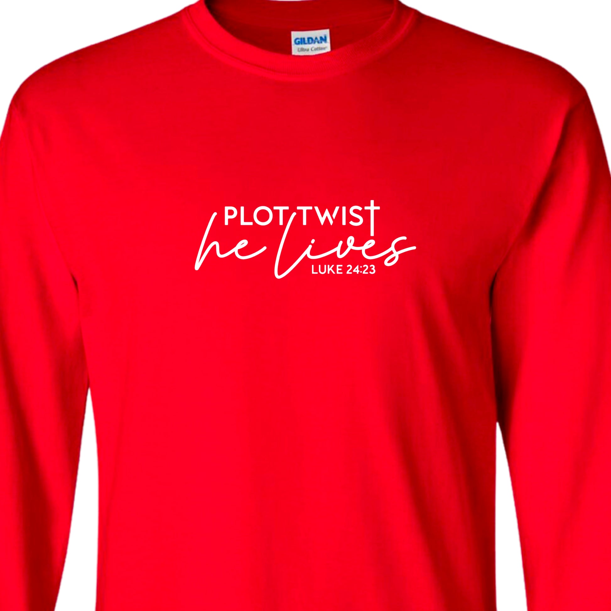 Red adult long sleeved shirt that reads, in white lettering: Plot Twist, He Lives - Luke 24:23